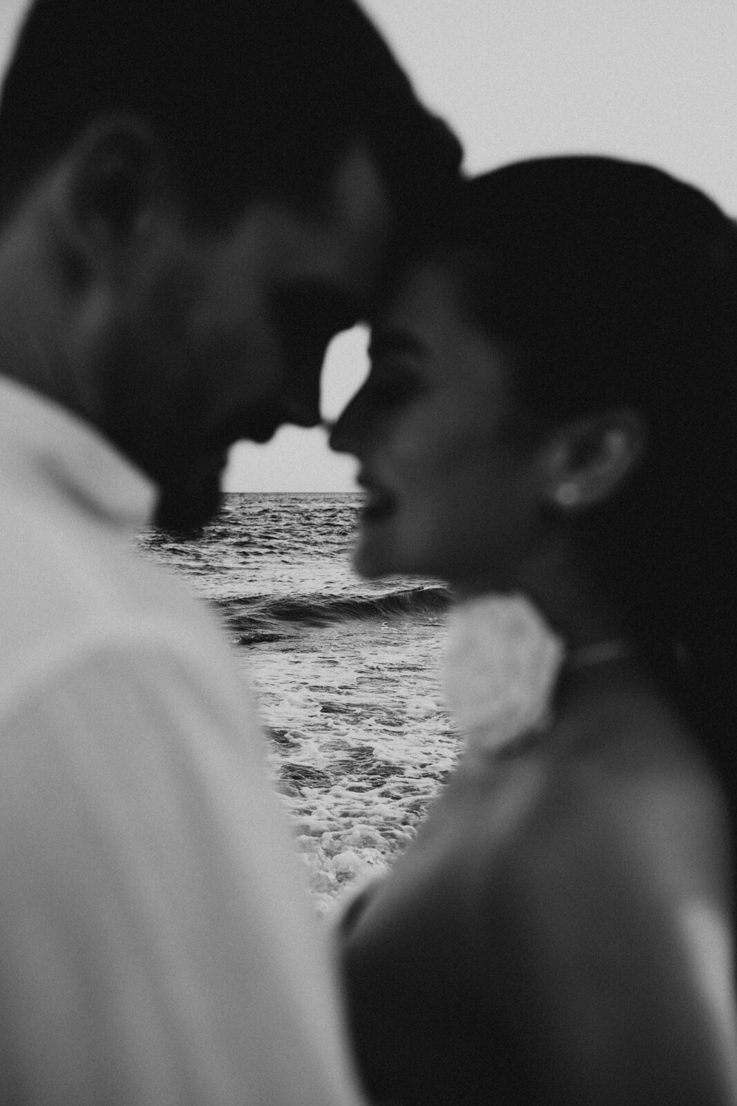 Sofia and Cameron sharing a quiet moment by the sea