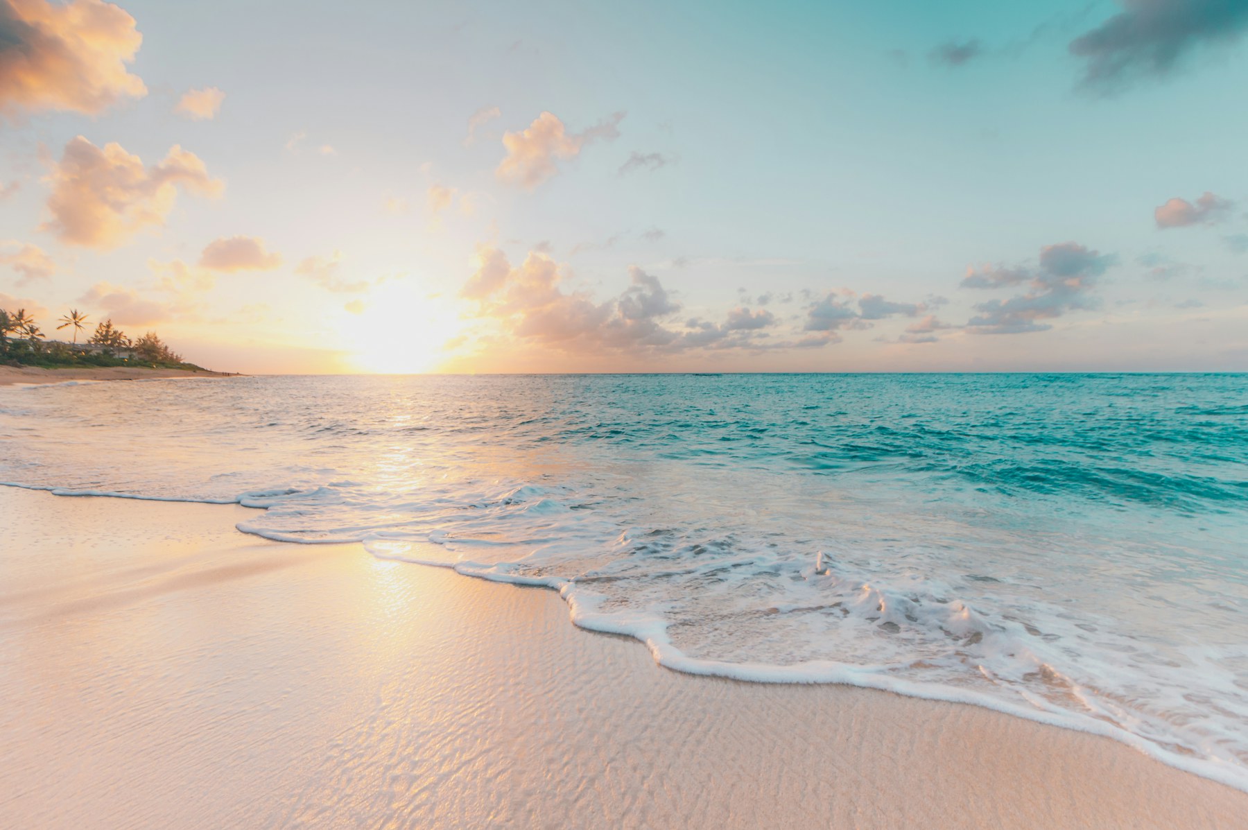 Turquoise water along the coast of Isla Mujeres at sunset