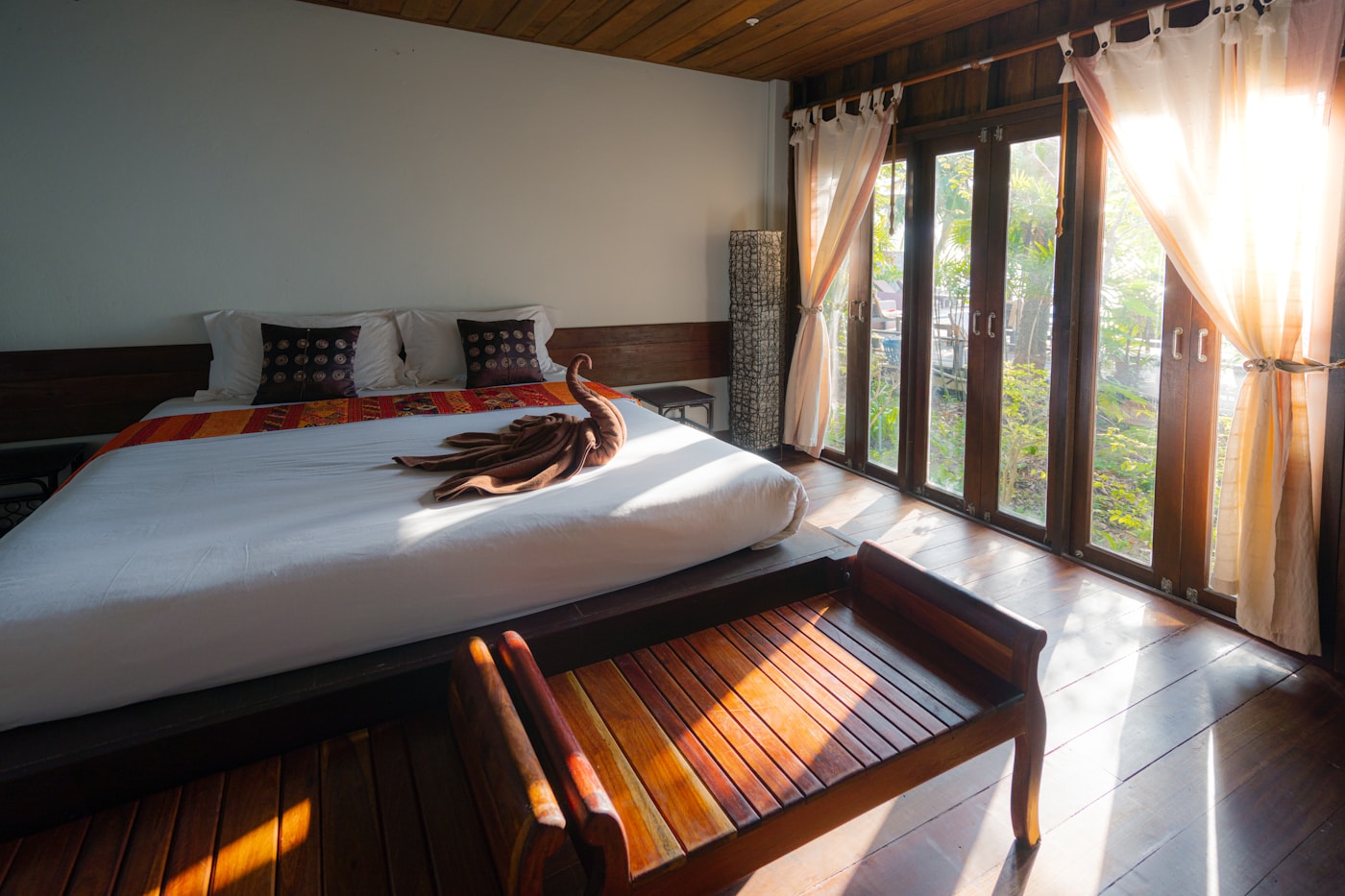 Beachfront resort framed by tropical plants